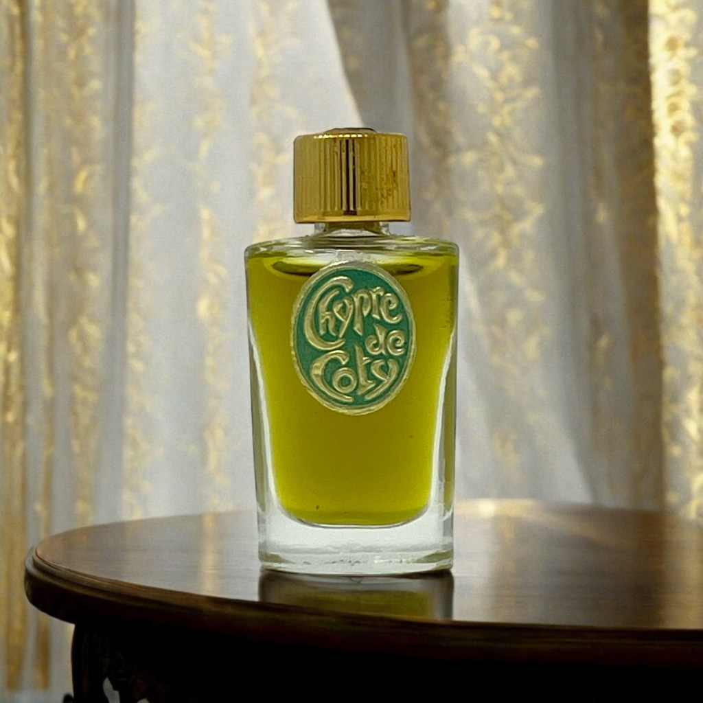 A bottle of perfume sitting on a table